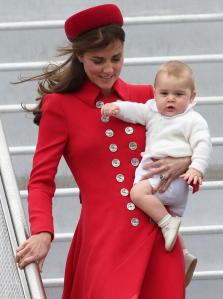 Prince-George-and-the-Duchess-of-Cambridge-arrive-in-New-Zealand-red-outfit-and-hat-2014